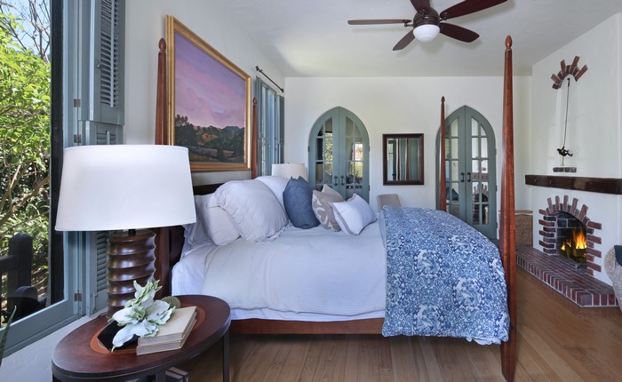 Bedroom with Four-Poster Bed and Fireplace