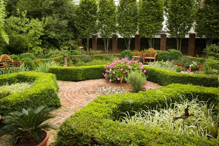 Formal Garden with Boxwood Hedges and Brick Paths