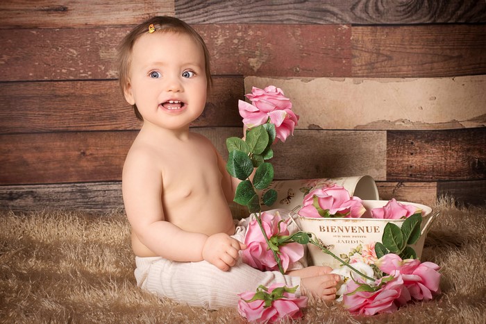 Baby girl with pink roses