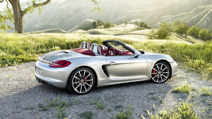 Silver Porsche Boxster Cabriolet on a gravel road