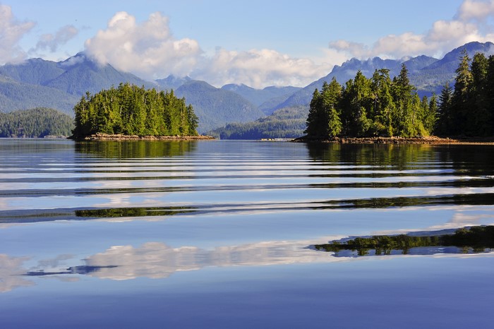 Islands and mountains reflected in a lake in Ucluelet, Canada