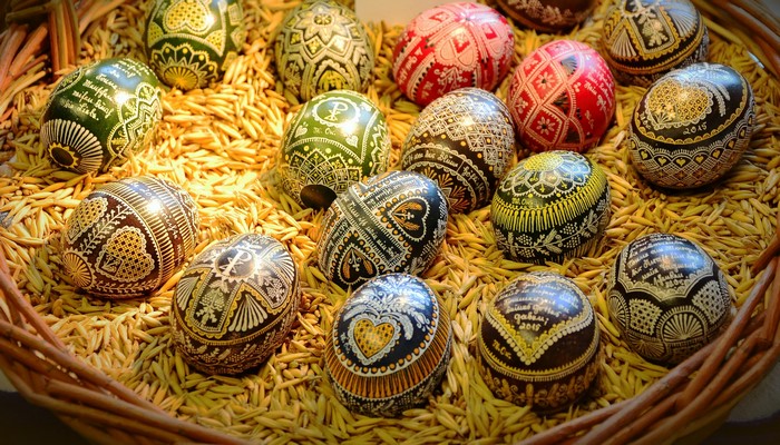 Decorated Easter Eggs in a Basket of Grain