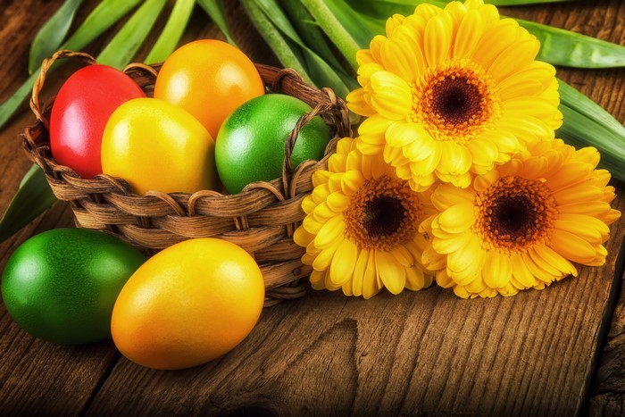 Easter Eggs in a Basket with Yellow Gerbera Daisies