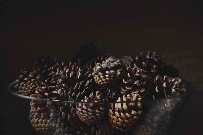 Pine cones in a glass bowl