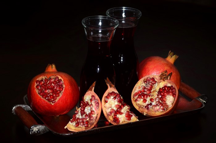 Pomegranate Juice in Bottles with Pomegranates