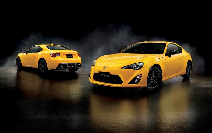 Two yellow Toyota 86 cars