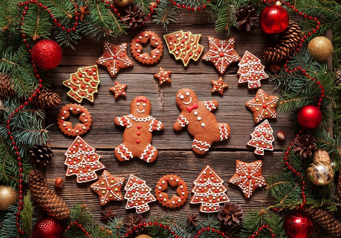Christmas cookies and decorations on wooden table