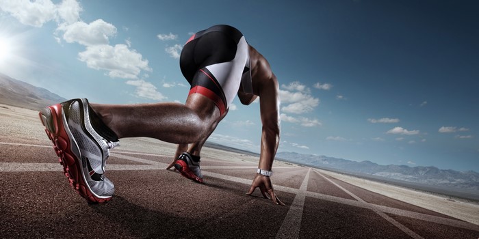 Runner in starting blocks on a track
