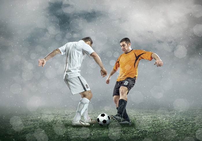 Two soccer players in a match