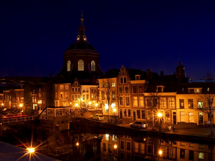Leiden, Netherlands at night with canal and buildings