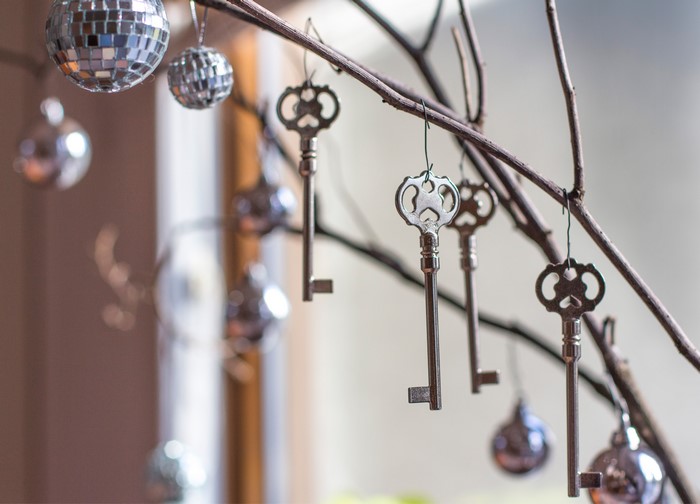 Keys and disco balls hanging from branches