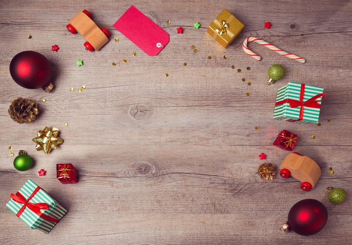 Christmas decorations and gifts on a wooden background