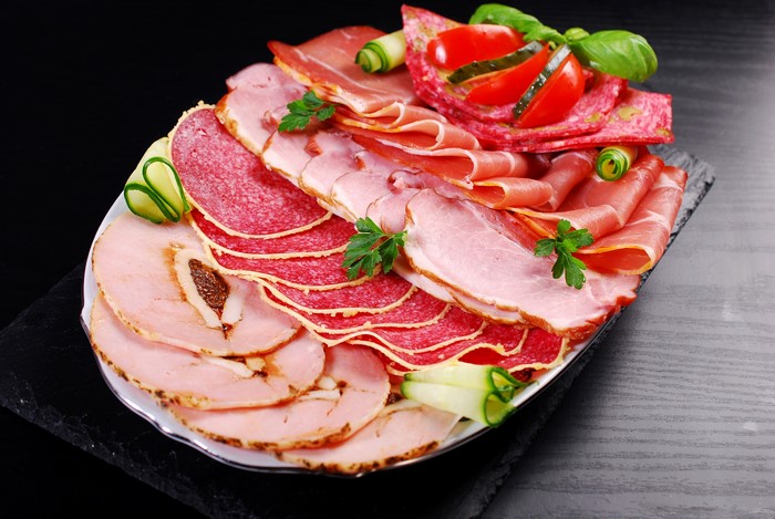 Meat platter with ham, salami, and vegetables