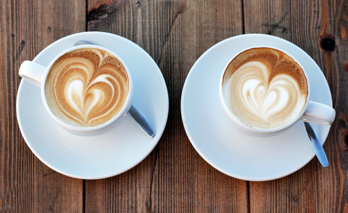 Two cups of cappuccino with latte art