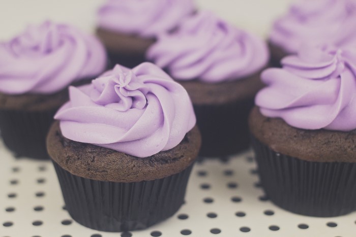 Chocolate cupcakes with purple frosting