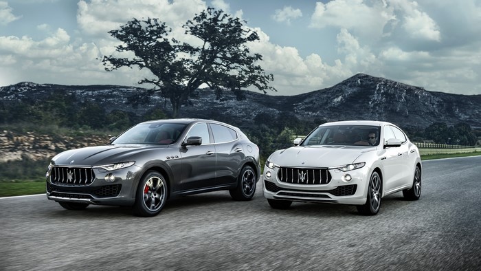 Two Maserati Levante SUVs on a Road