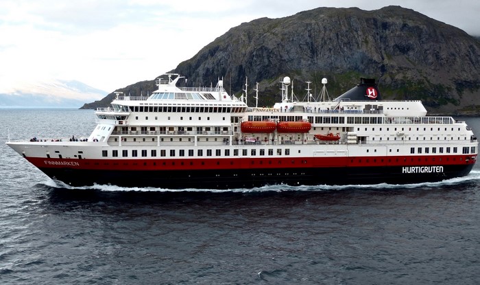 Hurtigruten Finnmarken cruise liner sailing near mountains