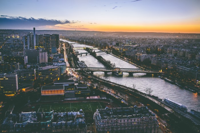Paris cityscape with Seine River and bridges at dusk