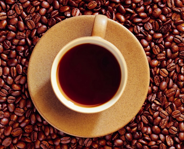 Cup of Coffee on Coffee Beans