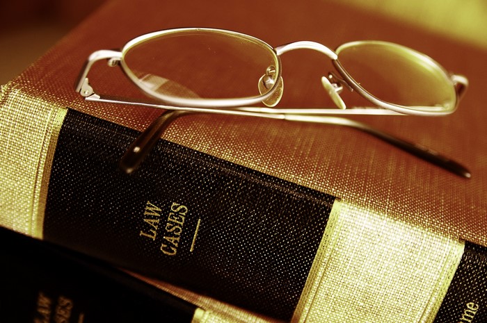 Glasses resting on law books