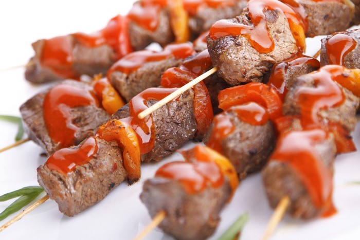 Meat shashlik with ketchup and bell peppers