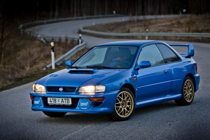 Blue 1998 Subaru Impreza 22B STi on a Winding Road