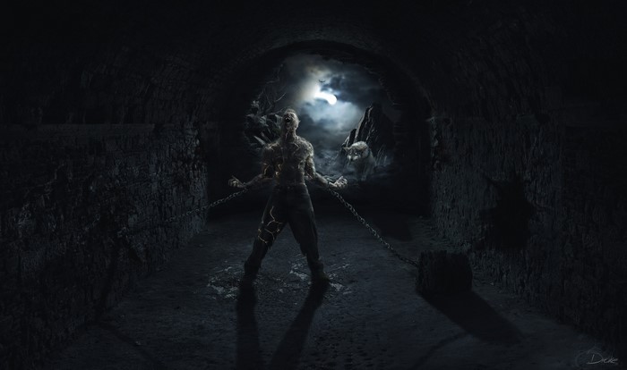 Chained monster in a dark cave with a wolf