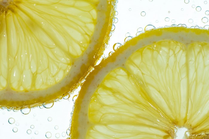 Close-up of Lemon Slices in Water with Bubbles
