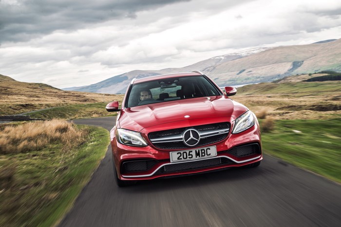 Red Mercedes-Benz 2015 AMG C 63 Estate S205 on road