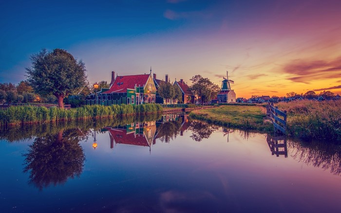 Zaanse Schans Netherlands houses and windmill at sunset