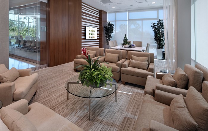 Modern office lounge with conference room view