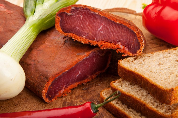Meat products with bread, onion, and peppers