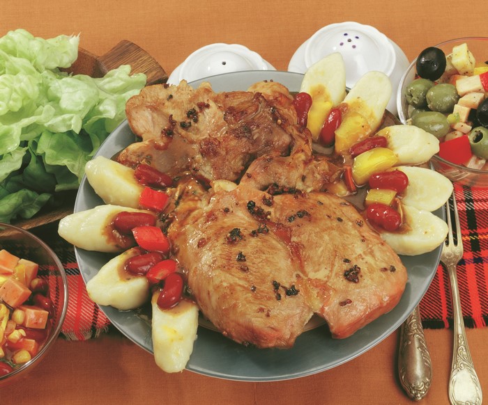 Pork chops with potato dumplings and salad