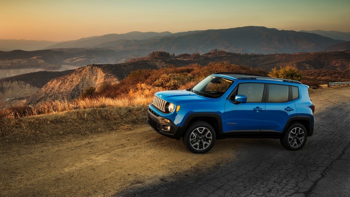 Blue Jeep Renegade Latitude on a mountain road
