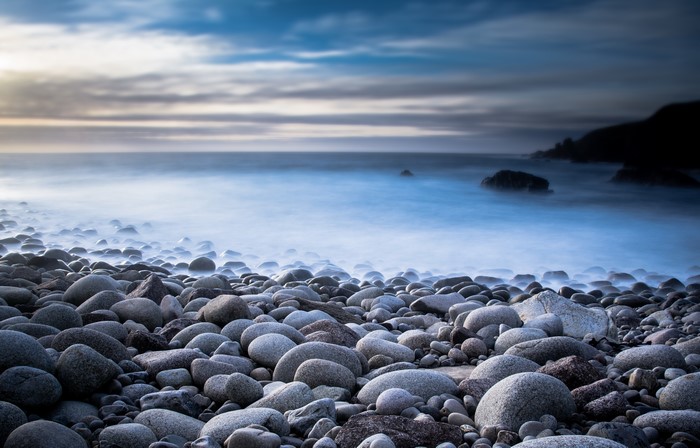 Stones on a rocky coast with ocean waves