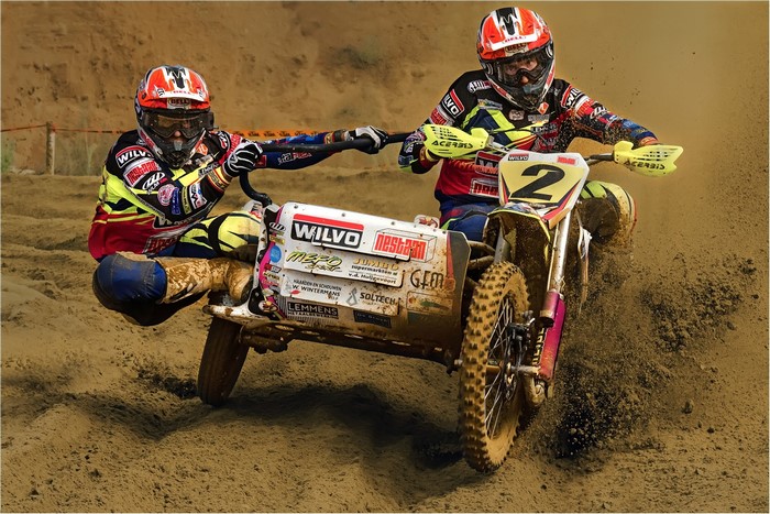 Motocross sidecar race with two riders