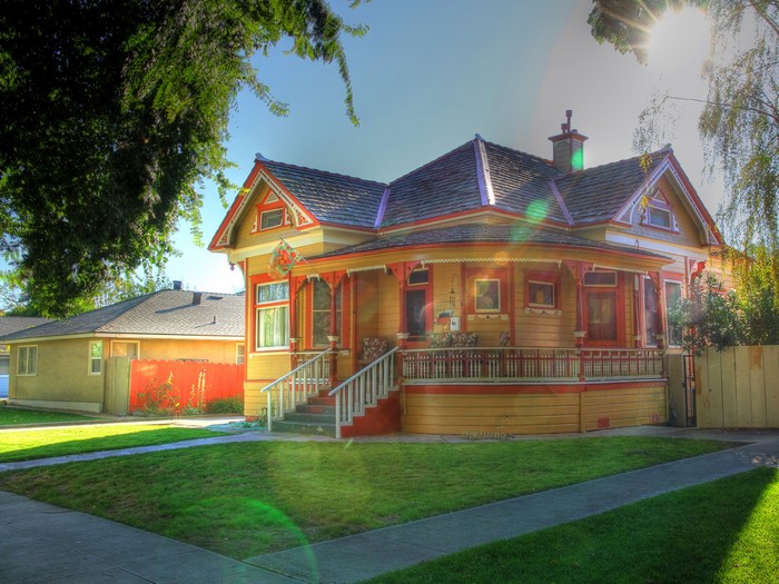 Victorian House with Yellow and Red Exterior