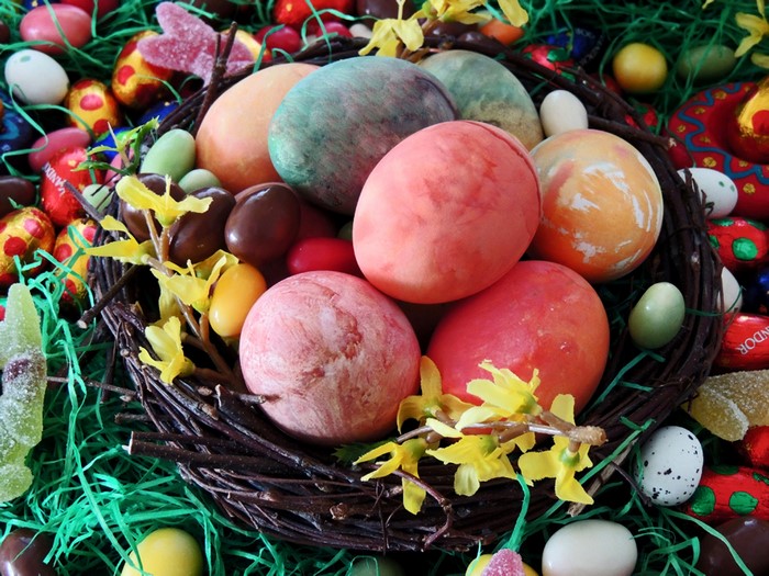 Easter eggs and candies in a nest