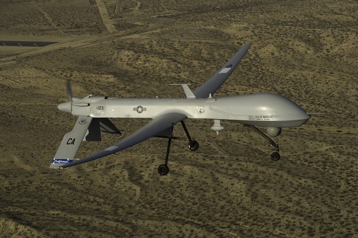 Predator MQ-1 UAV in flight over desert