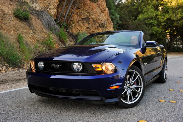 Blue 2010 Ford Mustang GT Convertible on a Road