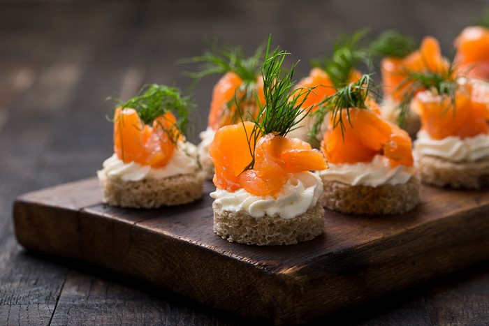 Smoked salmon canapés with cream cheese and dill
