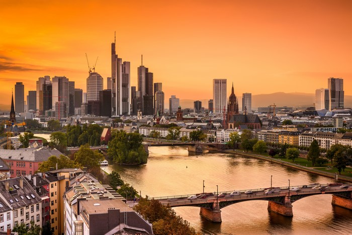 Frankfurt skyline with river and bridges at sunset