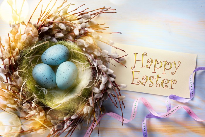 Easter eggs in a nest with a Happy Easter card