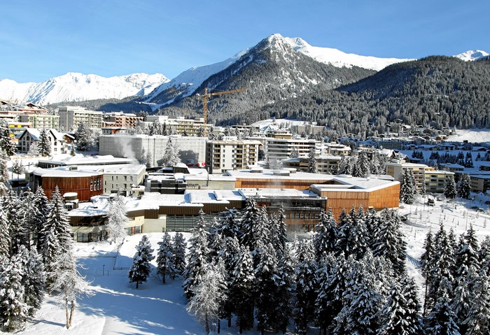 Davos, Switzerland in Winter with Snow-Covered Mountains and Spruce Trees