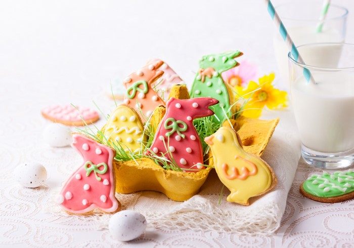 Easter cookies in egg carton with milk glasses