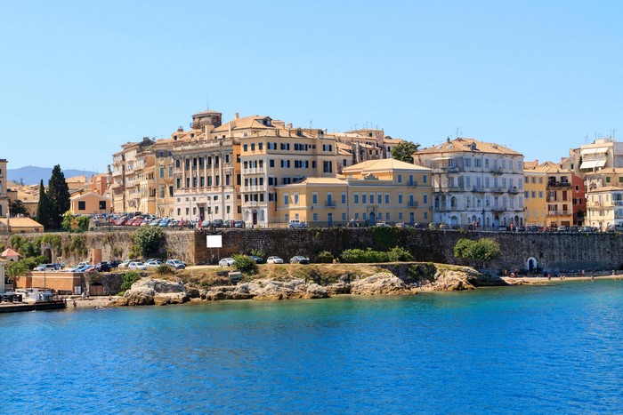 Corfu, Greece waterfront with historic buildings and blue sea