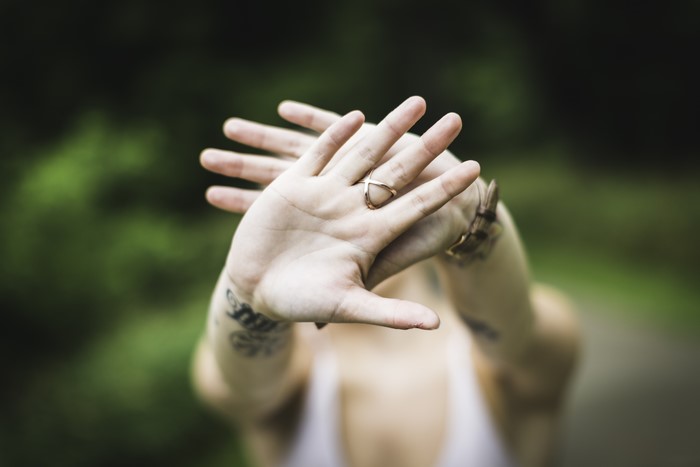 Hands with tattoos and rings