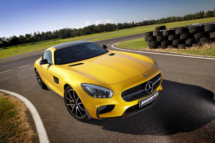 Yellow Mercedes-Benz AMG GT S on a race track