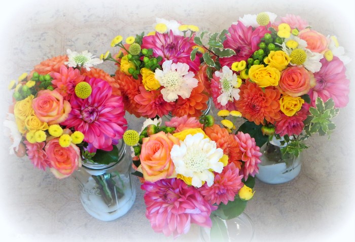 Bouquets of Roses and Dahlias in Mason Jars