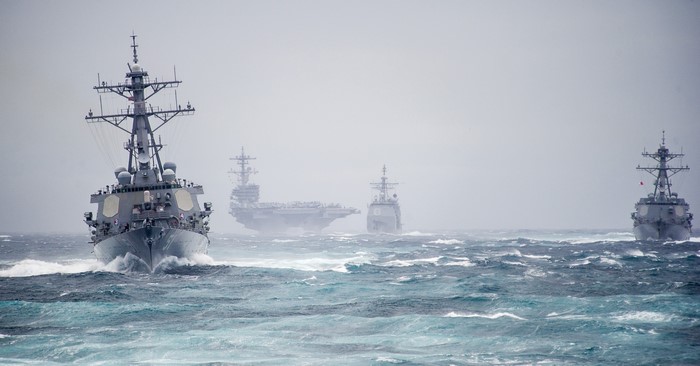 US Navy Ships Sailing in Rough Seas